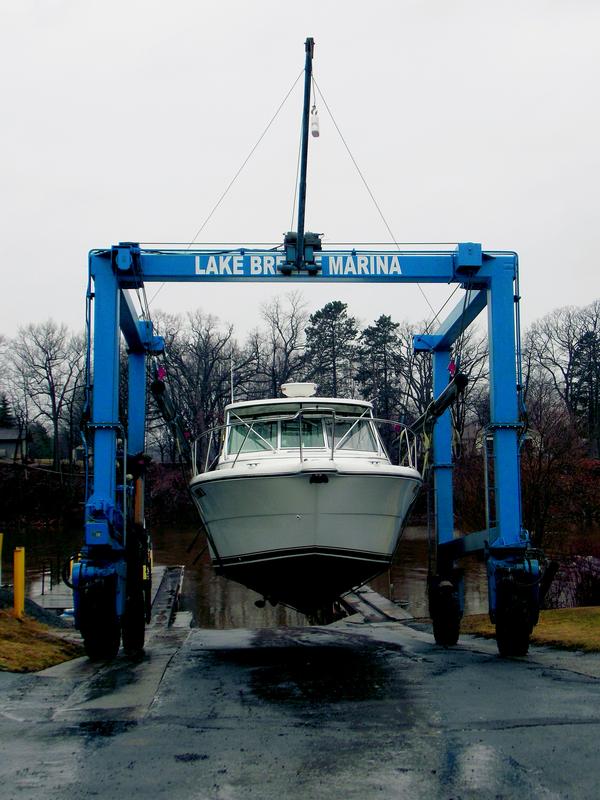 A boat owned by Bob Stevens of Medina is launched into Oak Orchard River Friday afternoon. The boat was stored at Lake Breeze Marina over the winter, which changed ownership earlier this year when 10-year employee Gatlen Ernst bought it from long-time owners Doug and Jan Bennett.